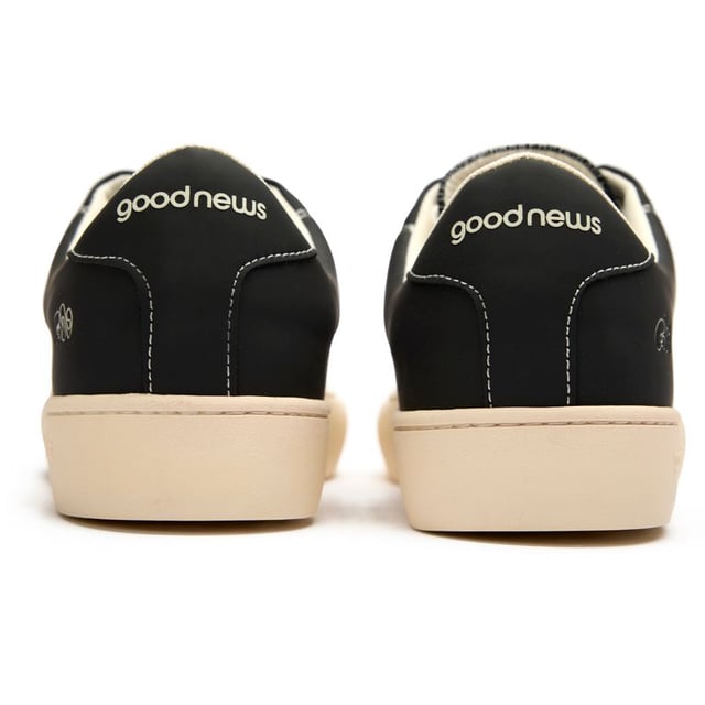 The GOOD NEWS Slimer delivers understated style with serious eco-credentials. These black court trainers combine a sleek bio plant and suede upper with the brand's signature round toe shape for a distinctive silhouette. Comfort comes naturally with the breathable cushioned footbed and 100% recycled foam insole. The recycled rubber sole adds durability while minimizing environmental impact. With minimal branding, these versatile casual trainers offer sustainable style that works effortlessly with any outfit.