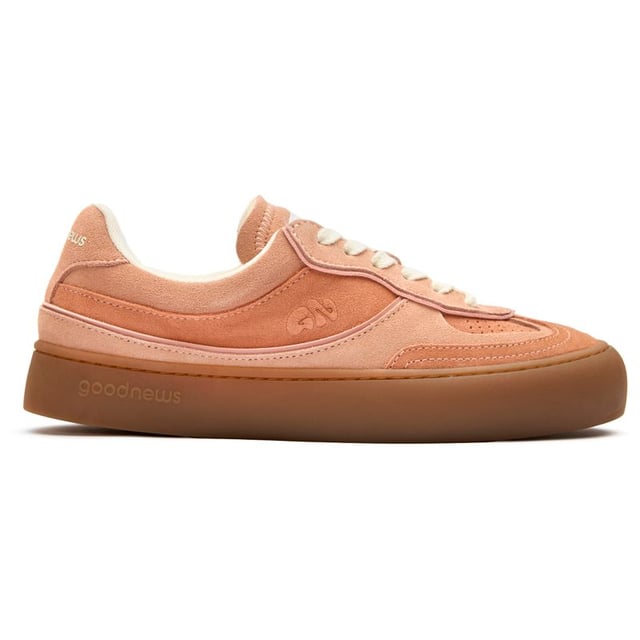 The GOOD NEWS Lagoon elevates everyday casual with its striking pink suede crafted from premium deadstock materials. These handmade court trainers balance eco-conscious design with street-ready style, featuring subtle stamped GN motifs and sturdy rubber soles for dependable grip. The chunky organic cotton laces add textural interest, while recycled mesh lining ensures breathable comfort. Perfect for the conscious consumer who refuses to sacrifice style for sustainability in their footwear selection.
