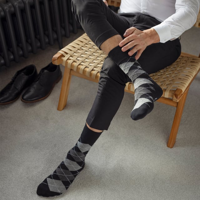Gentle Grip - Mens 12 Value Pack Non Elastic Patterned Socks: If you're searching for a way to liven up your wardrobe and inject a burst of vibrancy, then these Gentle Grip Socks are just what you need. With loads of designs to choose from, like Plain, Argyle, Colourburst, Heel & Toe, and more. These socks are the perfect way to add personality to any outfit, while also providing the comfort and quality that Gentle Grip is known for. Indulge in luxurious comfort with Gentle Grip, crafted from premium quality cotton-rich yarn that feels as good as it looks. These socks are carefully designed to provide a superior fit that hugs your legs without causing any discomfort or unsightly constriction rings. The high-quality construction of these socks is built to last, ensuring that you can enjoy their softness and comfort for years to come. . These are available in 2 sizes: 6-11 UK & 12-14 UK, come in a range of great patterns and are a 12 pair value pack. They are made from: 76% Cotton, 19% Polyester, 3% Nylon, 2% Elastane and are Machine Washable. Extra Product Details: Men’s Gentle Grip Socks 12 Pair Value Pack Classic & Funky Patterns Bright Colour Options Non Elastic Top Soft Cotton Rich Fibres Soft Honeycomb Top Helps Aid Circulation Constructed With Care Over 20 Different Styles Available in 6-11 UK & 12-14 UK Machine Washable