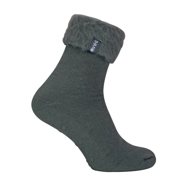 THMO Men’s Thermal Turnover Bed Socks: Embrace the cosy comfort of our THMO Bed Socks, your perfect pair for those chilly winter days and nights. As the temperature drops, it's essential to keep yourself warm while also saving on heating bills. Treat yourself to the ultimate warmth without compromising your budget. Crafted using a specially selected heavy bulk acrylic yarn, these socks possess exceptional thermal qualities that will keep your feet cosy even in the coldest of winters. . An innovative anti-slip grip has been designed onto the foot of the sock in order to prevent you from slipping on surfaces such as hard wooden floors or kitchen tiles. It is a simple but effective dotted design on the foot of the sock. By effectively trapping warm air and enveloping your feet in comfort, these bed socks are the perfect choice for those moments of indoor relaxation and tranquillity. The THMO badge is also heat transferred onto the side of the sock. These THMO thermal bed socks are available in 3 colours: Black, Navy & Charcoal, with dotted grippers. They are available in one size Men’s 6-11 UK. They are made from 93% Acrylic, 6% Polyamide & 1% Elastane. They are also safely machine washable. Extra Product Details: THMO Slipper Bed Socks Double Brushed Inner Thick & Warm Hand Linked Toe Turnover Top Non-Slip Grippers 3 Colour Options Men’s One Size 6-11 UK Machine Washable