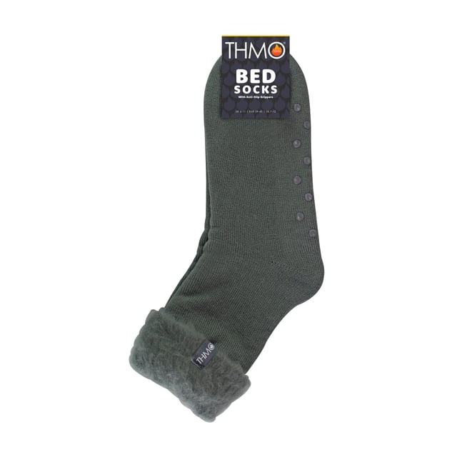 THMO Men’s Thermal Turnover Bed Socks: Embrace the cosy comfort of our THMO Bed Socks, your perfect pair for those chilly winter days and nights. As the temperature drops, it's essential to keep yourself warm while also saving on heating bills. Treat yourself to the ultimate warmth without compromising your budget. Crafted using a specially selected heavy bulk acrylic yarn, these socks possess exceptional thermal qualities that will keep your feet cosy even in the coldest of winters. . An innovative anti-slip grip has been designed onto the foot of the sock in order to prevent you from slipping on surfaces such as hard wooden floors or kitchen tiles. It is a simple but effective dotted design on the foot of the sock. By effectively trapping warm air and enveloping your feet in comfort, these bed socks are the perfect choice for those moments of indoor relaxation and tranquillity. The THMO badge is also heat transferred onto the side of the sock. These THMO thermal bed socks are available in 3 colours: Black, Navy & Charcoal, with dotted grippers. They are available in one size Men’s 6-11 UK. They are made from 93% Acrylic, 6% Polyamide & 1% Elastane. They are also safely machine washable. Extra Product Details: THMO Slipper Bed Socks Double Brushed Inner Thick & Warm Hand Linked Toe Turnover Top Non-Slip Grippers 3 Colour Options Men’s One Size 6-11 UK Machine Washable