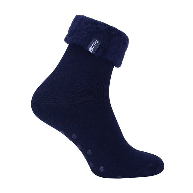 THMO Men’s Thermal Turnover Bed Socks: Embrace the cosy comfort of our THMO Bed Socks, your perfect pair for those chilly winter days and nights. As the temperature drops, it's essential to keep yourself warm while also saving on heating bills. Treat yourself to the ultimate warmth without compromising your budget. Crafted using a specially selected heavy bulk acrylic yarn, these socks possess exceptional thermal qualities that will keep your feet cosy even in the coldest of winters. . An innovative anti-slip grip has been designed onto the foot of the sock in order to prevent you from slipping on surfaces such as hard wooden floors or kitchen tiles. It is a simple but effective dotted design on the foot of the sock. By effectively trapping warm air and enveloping your feet in comfort, these bed socks are the perfect choice for those moments of indoor relaxation and tranquillity. The THMO badge is also heat transferred onto the side of the sock. These THMO thermal bed socks are available in 3 colours: Black, Navy & Charcoal, with dotted grippers. They are available in one size Men’s 6-11 UK. They are made from 93% Acrylic, 6% Polyamide & 1% Elastane. They are also safely machine washable. Extra Product Details: THMO Slipper Bed Socks Double Brushed Inner Thick & Warm Hand Linked Toe Turnover Top Non-Slip Grippers 3 Colour Options Men’s One Size 6-11 UK Machine Washable