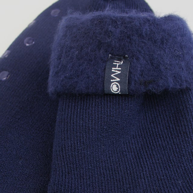 THMO Men’s Thermal Turnover Bed Socks: Embrace the cosy comfort of our THMO Bed Socks, your perfect pair for those chilly winter days and nights. As the temperature drops, it's essential to keep yourself warm while also saving on heating bills. Treat yourself to the ultimate warmth without compromising your budget. Crafted using a specially selected heavy bulk acrylic yarn, these socks possess exceptional thermal qualities that will keep your feet cosy even in the coldest of winters. . An innovative anti-slip grip has been designed onto the foot of the sock in order to prevent you from slipping on surfaces such as hard wooden floors or kitchen tiles. It is a simple but effective dotted design on the foot of the sock. By effectively trapping warm air and enveloping your feet in comfort, these bed socks are the perfect choice for those moments of indoor relaxation and tranquillity. The THMO badge is also heat transferred onto the side of the sock. These THMO thermal bed socks are available in 3 colours: Black, Navy & Charcoal, with dotted grippers. They are available in one size Men’s 6-11 UK. They are made from 93% Acrylic, 6% Polyamide & 1% Elastane. They are also safely machine washable. Extra Product Details: THMO Slipper Bed Socks Double Brushed Inner Thick & Warm Hand Linked Toe Turnover Top Non-Slip Grippers 3 Colour Options Men’s One Size 6-11 UK Machine Washable