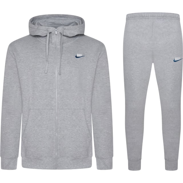 Layer up in this men's Foundation Tracksuit from Nike. In a Dark Grey Heather colourway, this matching set includes a full zip hoodie and standard fit joggers, both made from soft brushed fleece for all-day comfort. The hoodie features an adjustable drawstring hood, full-zip fastening, ribbed trims, and a split kangaroo pocket for essential storage. The joggers come with an elastic waistband and adjustable drawcord for a custom fit, ribbed ankle cuffs to maintain shape, and side pockets for convenience. Finished with signature Nike Swoosh embroidery to the chest and thigh for a classic look.