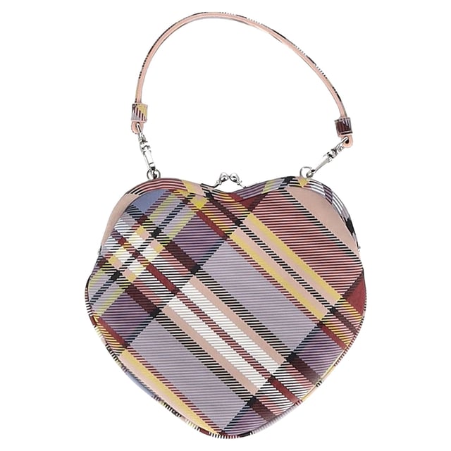 VINTAGE, RRP AS NEW
The Vivienne Westwood Belle Heart Clutch Bag in multicolor leather is a whimsical statement piece, featuring a sculptural heart shape and vibrant, artistic print that captures the brand’s avant-garde spirit. Crafted with smooth leather and finished with the signature Orb emblem, it’s both playful and luxurious. **Styling Tip:** Pair it with a minimalist dress or sleek jumpsuit to let the bag shine as your standout accessory.

 Vivienne Westwood Belle Heart Clutch Bag in Multicolor Leather

Condition: Excellent
Signs of wear: No retail tag, No visible sign of wear., 
Packaging: Dust bag
Color: Multicolor | multicolor
Material: Leather
Size: One Size | One Size
Measurements: Width: 10; Height: 180; Length: 200; Handle drop: 0; Strap length: 0
SKU: NAPPUGBBA487805W