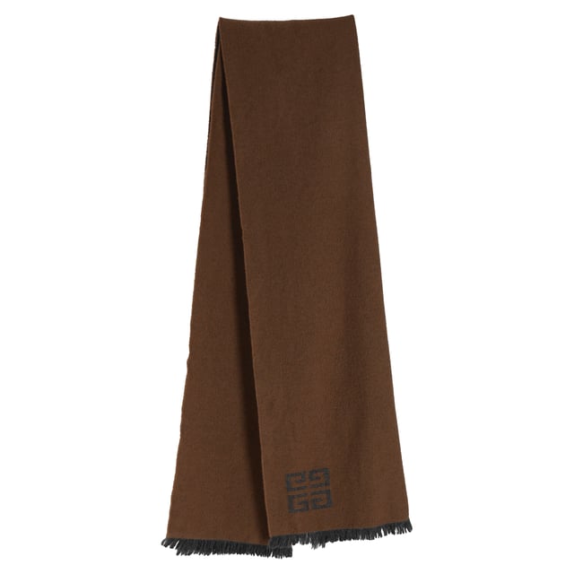 VINTAGE, RRP AS NEW
Wrap yourself in luxury with the Givenchy Monogram Fringed Reversible Scarf, crafted in soft wool and showcasing the iconic logo in versatile grey and brown tones. The reversible design offers two chic looks in one, finished with delicate fringe detailing for a touch of texture. **Styling tip:** Drape it over a tailored coat or belt it at the waist over a neutral sweater dress for effortless cold-weather sophistication.

Givenchy Monogram Fringed Reversible Scarf in Grey and Brown Wool

Condition: Excellent
Signs of wear:  No sign of wear.
Packaging: None
Color: Grey
Material: Wool
Size: One Size | One Size
Measurements: Height: 1840; Length: 450
SKU: TONPUDEAC507957W