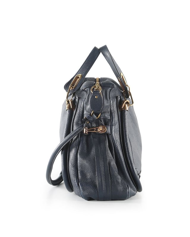 VINTAGE, RRP AS NEW
This Chloe bag is crafted from navy blue calfskin leather. The bag features double flat leather handles, detachable shoulder strap, front and back piped trim details, sides twist-locks can be unfastened to expand the bag, top zip closure, black canvas interior lined with a zipped pocket, and gold tone hardware. The bag is in very good condition, yet the shoulder strap is slightly creased and the back of the bag shows minor faded stains. The bottom of the bag and the bottom corners are slightly scuffed. The interior is intact. Product code: 03-11-50.
Chloe Chloe Blue Leather Paraty Shoulder Bag
Color: blue | navy blue
Material: Leather
Condition: very good
Size: One Size 
Sign of wear: No
SKU: 158169 / RWB-272 / RWB-272 
Dimensions:  Length: 460 mm, Width: 130 mm, Height: 350 mm
Chloe Chloe Blue Leather Paraty Shoulder Bag
Color: blue | navy blue
Material: Leather | Leather
Condition: very good
Size: One Size | One Size
Sign of wear: No
SKU: 444385 / RWB-272 / RWB-272 
Dimensions:  Length: 460 mm, Width: 130 mm, Height: 350 mm