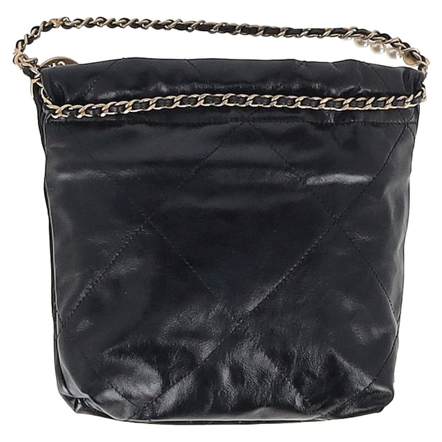 VINTAGE, RRP AS NEW
The Chanel 22 Quilted Mini Bag in Black Shiny Calfskin is the ultimate fusion of heritage and modernity. Crafted in supple diamond-stitched calfskin and finished with aged gold hardware, this mini marvel exudes effortless Parisian chic. The iconic Chanel logo, leather-threaded chain strap, and medallion charm lend a luxurious touch to a piece that’s both light and bold in personality.


Chanel 22 Quilted Mini Hobo Bag in Black Shiny Calfskin Leather
Condition: Excellent
Signs of wear: No retail tag, No visible sign of wear., 
Packaging: None
Color: black
Material: Leather | leather
Size: One Size | One Size
Measurements: Width: 70; Height: 190; Length: 230
SKU: NAPPUGBBA512640W