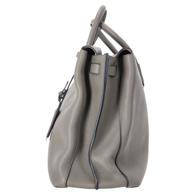 VINTAGE, RRP AS NEW
The MCM Maxim Tote Bag in grey leather combines refined craftsmanship with everyday functionality, featuring a spacious interior and clean, structured lines. Subtle logo detailing and smooth leather make it a versatile choice for both work and weekend wear. **Style tip:** Pair it with a tailored coat and leather sneakers for a sleek, contemporary city look.

 MCM Maxim Tote Bag in Grey Leather

Condition: Excellent
Signs of wear: No visible signs of wear
Packaging: Dust bag
Color: Grey
Material: Leather | leather
Size: One Size | One Size
Measurements: Width: 180; Height: 310; Length: 500; Handle drop: 390; Strap length: -
SKU: MRPPUDEBA525309W