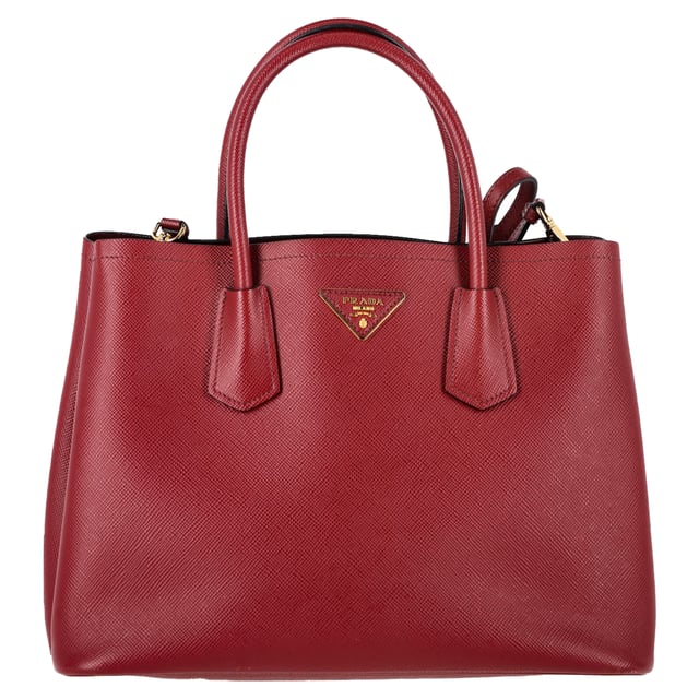 VINTAGE, RRP AS NEW
The Prada Double Handle Tote in rich Cerise red Saffiano leather (BN2775) is the perfect blend of sophistication and function. Crafted from iconic cross-hatched Saffiano leather, it features rolled top handles, gold-tone logo detailing, and a spacious, dual-compartment interior with a center snap pocket—ideal for organizing work or daily essentials. Its structured silhouette makes it a timeless, go-anywhere companion.


Prada Double Handle Tote Bag in Red Saffiano Leather
Condition: Excellent
Signs of wear: No retail tag, No visible sign of wear., 
Packaging: Dust bag
Color: Red 
Material: Leather | leather
Size: One Size | One Size
Measurements: Width: 150; Height: 240; Length: 340; Handle drop: 120; Strap length: 1200
SKU: NAPPUGBBA506565W