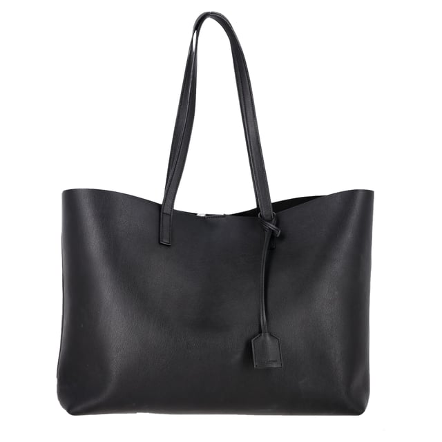 VINTAGE, RRP AS NEW
Effortlessly chic and endlessly practical, this Saint Laurent East/West tote is the definition of understated luxury. Crafted in Italy from supple black textured leather, it features a roomy, unstructured silhouette that fits everything from your laptop to a makeup bag. A gleaming gold 'YSL' charm and detachable coin pouch complete the polished design. The perfect carryall for your workday, weekend, or in-flight essentials.


Saint Laurent East/West Large Textured Tote in Black Leather
Condition: Very good
Signs of wear: No retail tag, Minor sign of wear or markings., Lightly used but very well maintained. Minor creasing, light worn corners, light scratches.
Packaging: None
Color: black
Material: Leather | leather
Size: One Size | One Size
Measurements: Width: 470; Height: 150; Length: 280; Handle drop: 120; Strap length: 300
SKU: NAPPUGBBA516705W