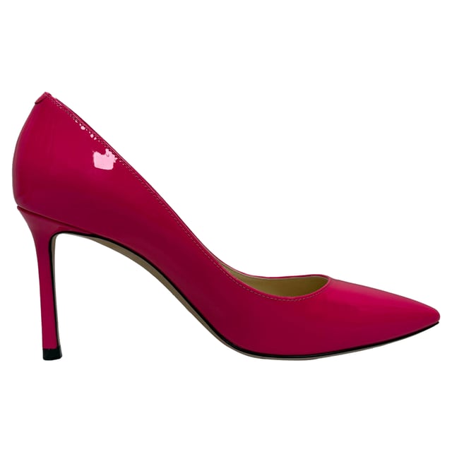 VINTAGE, RRP AS NEW
Feminine and refined, the **Jimmy Choo Romy Pointed Pumps** in pink patent leather offer a sleek silhouette with a glossy finish that radiates sophistication. The timeless pointed toe and slim stiletto heel make them a versatile choice for both day and night. **Styling Tip:** Pair them with a neutral-toned dress or tailored trousers to let the soft pink pop, adding a romantic touch to any ensemble.

 Jimmy Choo Romy Pointed Pumps in Pink Patent Leather

Condition: Very good
Signs of wear: Lightly used but very well maintained. Minor mark at soles & creasing, light scuffing at the soles and heels.
Packaging: Box
Color: Pink 
Material: Leather | patent leather
Size: EU | 35.5
Measurements: Heel height: 85 mm; Insole length: 250 mm
SKU: TONPUGBSH518671W