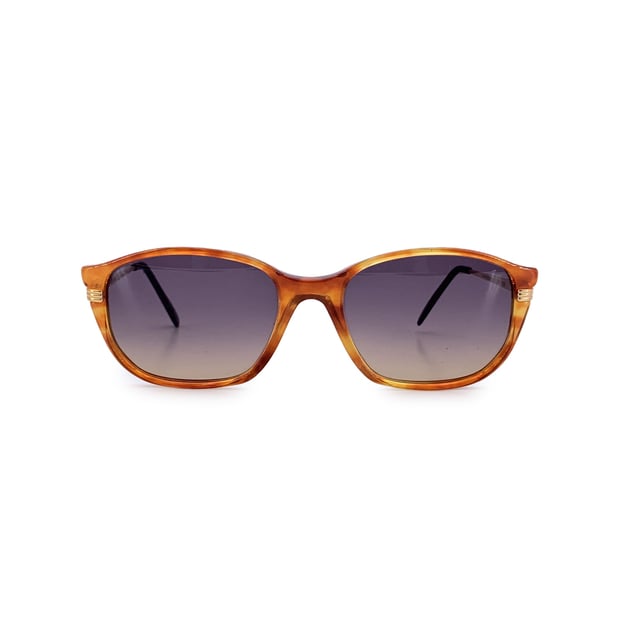 VINTAGE, RRP AS NEW
Step into timeless sophistication with these vintage Yves Saint Laurent sunglasses, model TITHON. Crafted in France, these shades embody the quiet elegance and bold spirit of '90s high fashion. The rich brown rectangular acetate frame strikes a perfect balance between structure and style, while grey gradient lenses offer just the right touch of mystery.  With a frame width of 140 mm and matching temple length, they offer a comfortable yet statement-making fit. A rare gem for true vintage collectors, the TITHON model reflects an era when every accessory was a piece of art-and these sunglasses are no exception.  In excellent vintage Condition Rating: A - EXCELLENTCondition Details: Gently Used. Lenses and frame in excellent condition. Please check the images carefully. Some show arrows indicating any evident defect. Please ask if you need to know more details or if you have any doubts. Generic case always included, please ask for availability of original case. Glasses maximum Width: 140mm Glasses Temple 140mm Glasses maximum lens width: 55mm Glasses maximum lens 42mm Glasses bridge width: 18mm Measurments:  width: 140 mm height: 42 mm