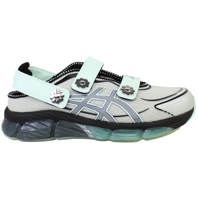 The ASICS × Cecilie Bahnsen Gel‑Quantum 360 VIII trainers blend cutting-edge sports performance with couture-level design. This limited-edition collaboration reimagines ASICS’ iconic full-GEL cushioning in a sandal-style silhouette featuring sculptural velcro straps adorned with delicate floral motifs. Crafted in a sophisticated grey palette, these trainers offer a wearable yet refined aesthetic that bridges athletic functionality with feminine elegance.
Key Features
Division Space Midsole Technology

Incorporates space between the GEL and midsole layers, delivering lightweight cushioning and enhanced responsiveness 

Full-Length GEL® 360 Cushioning

Surrounds the foot in cushioned support, providing superior shock absorption and plush comfort with every step 

FF Blast Plus ECO Foam

Utilizes eco-friendly foam with at least 20% sugarcane-derived biomass for resilience and sustainable performance 

5D Printed Mesh Upper

Tech-inspired, two-tone mesh base enhanced with three-dimensional prints that mimic organic, ergonomic structures 

Sandal-Inspired Velcro Straps

Three adjustable straps—including two Mary Jane style and one heel strap—each accented with metal flower embellishments for both decoration and secure fit 

Semi‑Transparent Rubber Outsole

Reveals a floral print nestled under the sole, blending design artistry with practical traction 

Advanced TRUSSTIC™ &amp; External Heel Counter

Integrated stability solutions provide structure and dynamic support during movement.