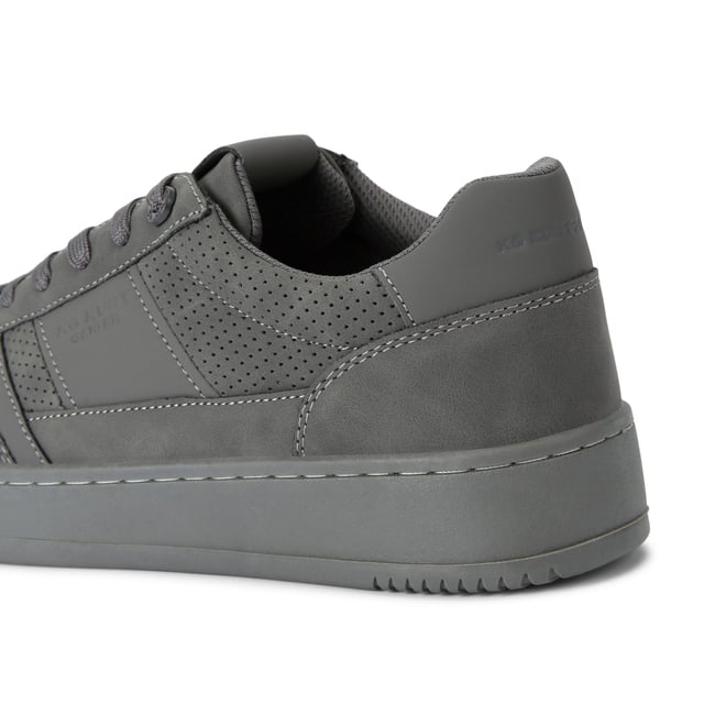 KG Kurt Geiger Jude Sneakers This Jude Sneaker is crafted from a grey micro suede with perforation for breathability. The front laces up with a grey branded tab.