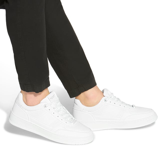 This Jude Sneaker is crafted from a white leather alternative with perforation for breathability. The front laces up with a white branded tab.