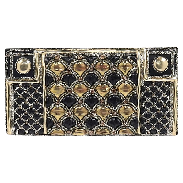 VINTAGE, RRP AS NEW
The Balmain Embellished Flap Clutch Bag in black and gold silk exudes opulence, adorned with intricate embellishments and the house’s signature bold detailing. Its sleek silhouette and luxurious finish make it the perfect statement accessory for evening occasions. **Style tip:** Pair it with a black tailored jumpsuit or a metallic gown to let the clutch shine as the centerpiece of your ensemble.

Balmain Embellished Flap Clutch Bag in Black and Gold Silk

Condition: Excellent
Signs of wear: No retail tag, No visible sign of wear., 
Packaging: None
Color: Black
Material: Silk
Size: One Size | One Size
Measurements: Width: 20; Height: 120; Length: 240
SKU: NAPPUGBSM524364W