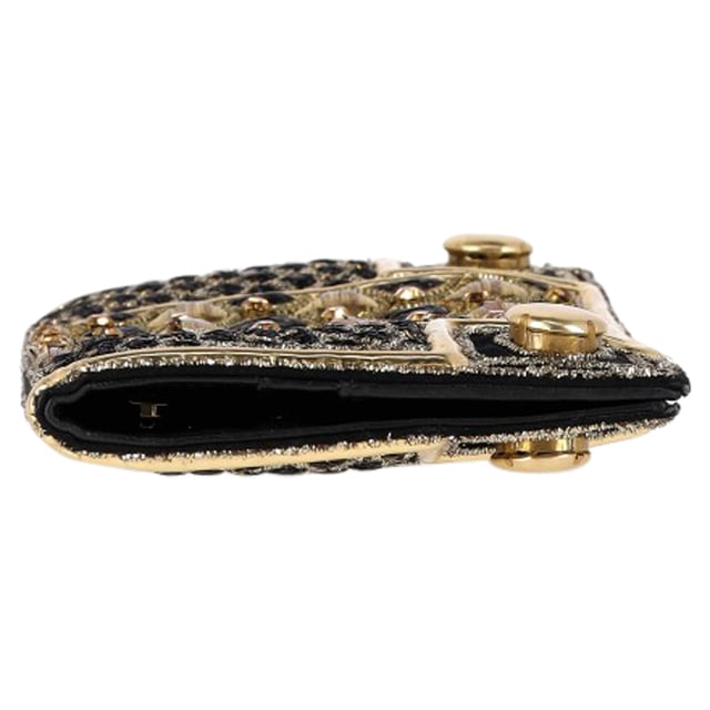 VINTAGE, RRP AS NEW
The Balmain Embellished Flap Clutch Bag in black and gold silk exudes opulence, adorned with intricate embellishments and the house’s signature bold detailing. Its sleek silhouette and luxurious finish make it the perfect statement accessory for evening occasions. **Style tip:** Pair it with a black tailored jumpsuit or a metallic gown to let the clutch shine as the centerpiece of your ensemble.

Balmain Embellished Flap Clutch Bag in Black and Gold Silk

Condition: Excellent
Signs of wear: No retail tag, No visible sign of wear., 
Packaging: None
Color: Black
Material: Silk
Size: One Size | One Size
Measurements: Width: 20; Height: 120; Length: 240
SKU: NAPPUGBSM524364W