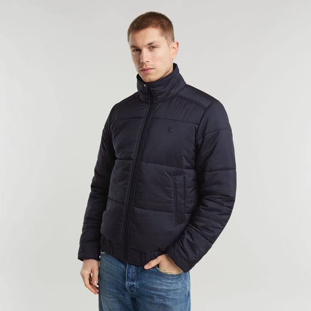 Raised collar. Zipper closure. Welt pockets at the waist, hidden snap button. Elasticated inner cuffs. Hanger loop inside. Zip closure. Padded jacket Quilted fis designed in a straight fit and offers a raised collar. Welt pockets at the waist are secured with a hidden snap button. An elasticated hemline and inner cuffs add to a comfortable fit. 100% Polyester (Recycled). Woven