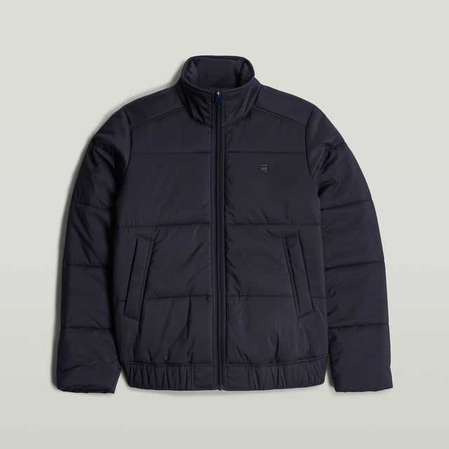 Raised collar. Zipper closure. Welt pockets at the waist, hidden snap button. Elasticated inner cuffs. Hanger loop inside. Zip closure. Padded jacket Quilted fis designed in a straight fit and offers a raised collar. Welt pockets at the waist are secured with a hidden snap button. An elasticated hemline and inner cuffs add to a comfortable fit. 100% Polyester (Recycled). Woven
