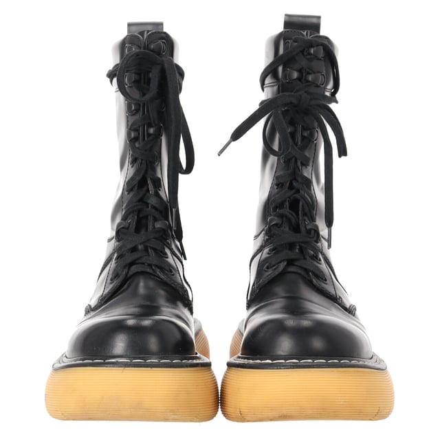 VINTAGE, RRP AS NEW
Command attention with the Bottega Veneta Bounce Mid-Calf Combat Boots, crafted from luxurious calf leather and set on a bold, sculptural sole for a powerful silhouette. These elevated combat boots combine utilitarian edge with Italian craftsmanship, delivering both comfort and high-fashion impact. **Styling tip:** Wear them with an oversized blazer and mini dress or tuck in relaxed trousers for a confident, street-style-ready look.

 Bottega Veneta Bounce Mid-Calf Combat Boots in Calf Leather

Condition: Very good
Signs of wear: Lightly used but very well maintained. Minor mark at soles & creasing, light scuffing at the soles and heels., Minor markings
Packaging: Dust bag
Color: Black
Material: Leather | calfskin leather
Size: EU | 37
Measurements: Insole length: 240
SKU: NAPPUDESH511927W