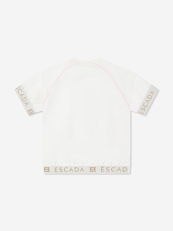 German heritage luxury label Escada embody modern innovation with timeless elegance. This girls snow white short sleeve t-shirt is woven in the finest high quality. It showcases Escada embroidery for a sleek and unforgettable look. Round Neck Short Sleeves Straight Hem 95 Cotton, 5 Elastane