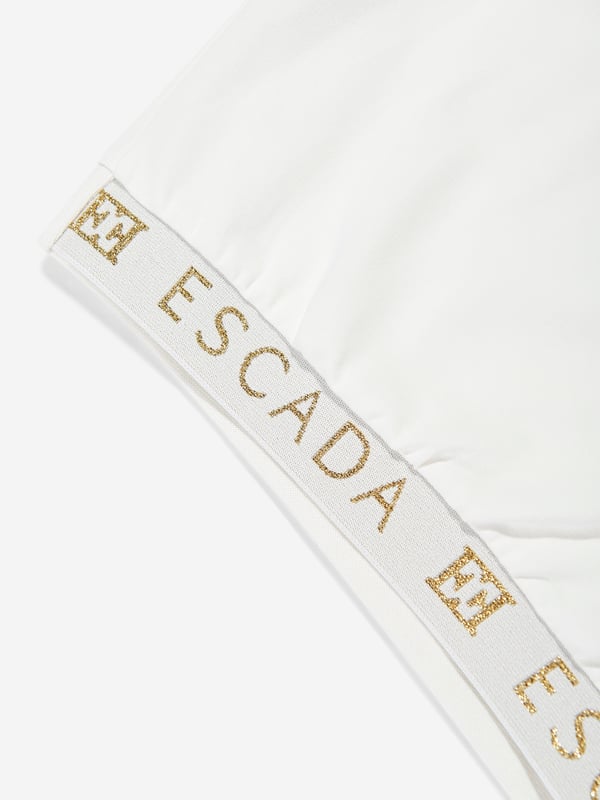 German heritage luxury label Escada embody modern innovation with timeless elegance. This girls snow white short sleeve t-shirt is woven in the finest high quality. It showcases Escada embroidery for a sleek and unforgettable look. Round Neck Short Sleeves Straight Hem 95 Cotton, 5 Elastane