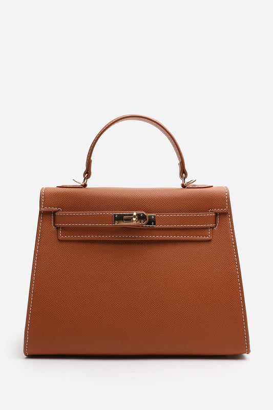 Elevate your everyday ensemble with this Lluvia Top Handle Satchel Mini Tote Bag, a timeless choice for modern elegance. Featuring a structured silhouette and refined grain-textured finish, this handbag blends style and practicality effortlessly. The polished gold-tone turn-lock closure adds a touch of sophistication. Ideal for work or weekend outings, it’s compact yet roomy enough for your essentials. Key Features: • Material: Textured faux leather with contrast stitching • Dimensions: 25cm (L) x 20cm (H) x 11cm (W) • Fastening: Gold-tone turn-lock flap closure • Detail: Minimalist top handle design with structured base and sleek finish 
