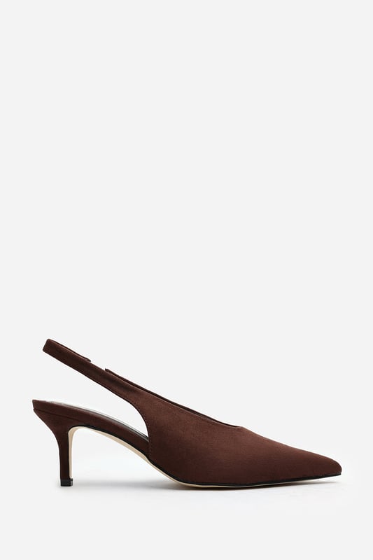 Wheres That From Womens 'Nora' Pointed Slingback Kitten Heels Step out in elegance with these Nora Pointed Slingback Kitten Heels, crafted in soft faux suede for a timeless finish. The pointed toe and low heel create a flattering, feminine silhouette perfect for day-to-night wear. Designed with a comfortable slingback strap, these heels pair effortlessly with dresses, trousers, or tailored sets. Key Features: • Material: Faux suede upper with smooth lining • Design: Pointed toe with slingback and kitten heel • Closure: Slip-on style with elasticated sling strap