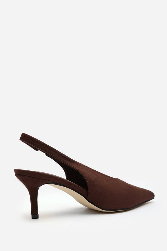 Wheres That From Womens 'Nora' Pointed Slingback Kitten Heels Step out in elegance with these Nora Pointed Slingback Kitten Heels, crafted in soft faux suede for a timeless finish. The pointed toe and low heel create a flattering, feminine silhouette perfect for day-to-night wear. Designed with a comfortable slingback strap, these heels pair effortlessly with dresses, trousers, or tailored sets. Key Features: • Material: Faux suede upper with smooth lining • Design: Pointed toe with slingback and kitten heel • Closure: Slip-on style with elasticated sling strap