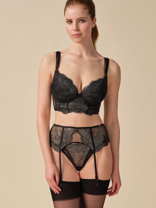 The VIP Intrigue collection is made to captivate with its seductive charm. Crafted from foil-printed stretch eyelash lace, each piece radiates sophistication and elegance. Polished rose gold hardware completes the look with Gossard’s signature touch. For an extra dose of glamour, a black faceted jewel droplet adorns the center front, elevating each piece to a new level of luxury. Pair the VIP lingerie set with the eye-catching black foil printed suspender, the perfect addition to complete the VIP Lingerie set.\r\n