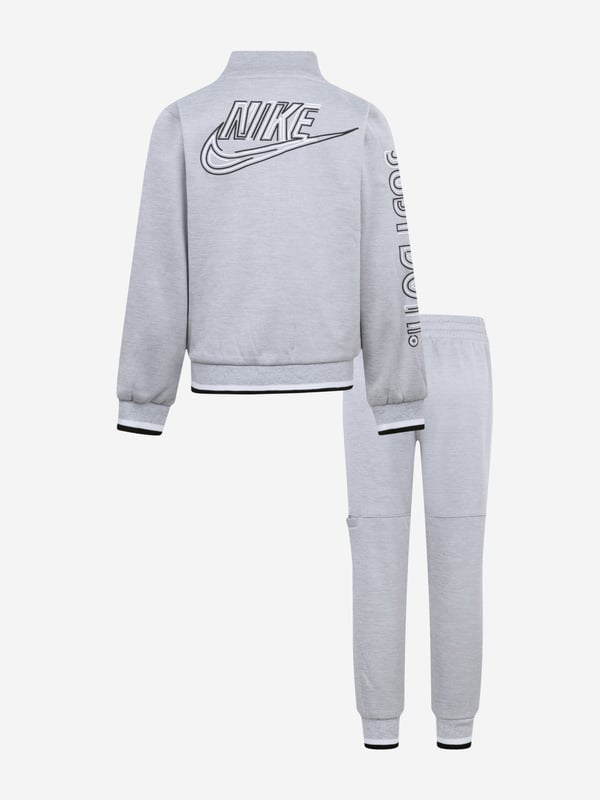 Discover the epitome of elegance with the Boys NSW Futura Propus Tracksuit in Grey by Nike, tailored for the discerning young gentleman for SS2025. Each element of this tracksuit is designed with unmatched sophistication Exquisite Craftsmanship Meticulously stitched using premium fabrics to offer both durability and comfort. Timeless Grey Palette A versatile, chic shade that ensures your boy remains the icon of playground fashion. Signature Nike Detailing Emblazoned with the iconic Nike Futura logo, adding a dash of athletic prestige.Elevate your boy's wardrobe with this stylish, comfortable piece. Perfect for any occasion, the Boys NSW Futura Propus Tracksuit promises to keep him looking sharp and feeling great.