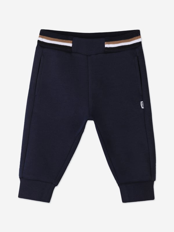 Unveil the epitome of style and comfort with the BOSS Baby Boys Logo Print Tracksuit in Navy, a sublime addition to your little one's SS2025 wardrobe. Crafted with precision, this ensemble offers a harmonious blend of elegance and playfulness Iconic BOSS Print Features a distinctive logo print, elevating your child's style quotient. Premium Comfort Crafted from luxurious fabrics, ensuring all-day ease and comfort. Versatile Navy Hue A sophisticated shade that complements any occasion.Refresh your child's collection with this chic, timeless tracksuit.