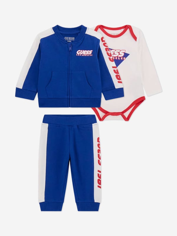 Introduce a splash of chic to your little chap's ensemble with the Guess Baby Boys 3 Piece Tracksuit Set in a radiant blue. Perfectly tailored for SS2025, this set ensures he looks dapper while promising unmatched comfort. Key features include Elegant Design Crafted with care, featuring stylish accents modern tailoring. Supreme Comfort Luxuriously soft fabrics that care for delicate skin. Versatile Wear Ideal for playdates or casual outings. Elevate his wardrobe with this exquisite set by Guess.