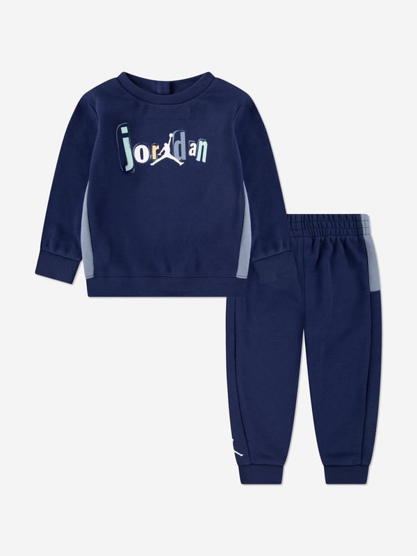 Introducing the Boys Jumpman Team Blocked Tracksuit in Navy by Jordan, crafted to elevate your boy's wardrobe for AW2024. This tracksuit seamlessly combines sophistication with athletic comfort. Key features include Signature Design Features the iconic Jumpman logo that sets it apart. Premium Fabric Constructed with high-quality materials ensuring durability comfort. Versatile Style Perfect for sports or casual outings. Striking Navy Blue A classic colour that offers endless styling options.Elevate your young one's fashion game with this exclusive piece!