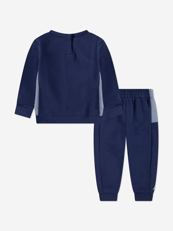 Introducing the Boys Jumpman Team Blocked Tracksuit in Navy by Jordan, crafted to elevate your boy's wardrobe for AW2024. This tracksuit seamlessly combines sophistication with athletic comfort. Key features include Signature Design Features the iconic Jumpman logo that sets it apart. Premium Fabric Constructed with high-quality materials ensuring durability comfort. Versatile Style Perfect for sports or casual outings. Striking Navy Blue A classic colour that offers endless styling options.Elevate your young one's fashion game with this exclusive piece!