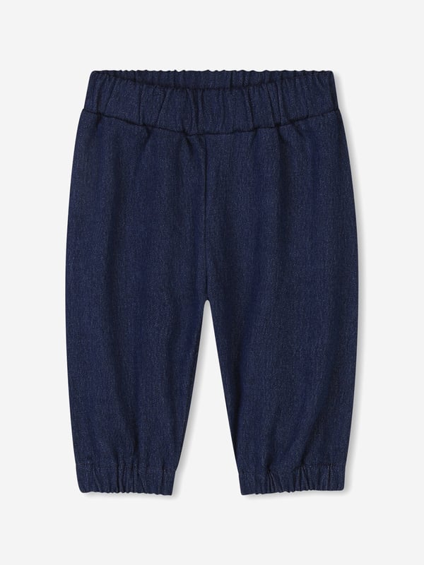 Givenchy's inherent sensibility and grammar of elegance are projected in this baby unisex denim blue tracksuit set. It contains a cardigan, trousers, and t-shirt. The cardigan is a bimaterial design via fleece denim and dynamic Givenchy patterning. The matching trousers are also engineered in the same material and design whilst the cotton jersey t-shirt showcases a metallic Givenchy print on the front. All of the pieces are beautifully presented in a gift box. Cardigan Front Snap Closure Trousers Elasticated Waist and Bottom Leg T-Shirt Shoulder Snap Closure 88 Cotton, 11 Polyester, 1 Elastane