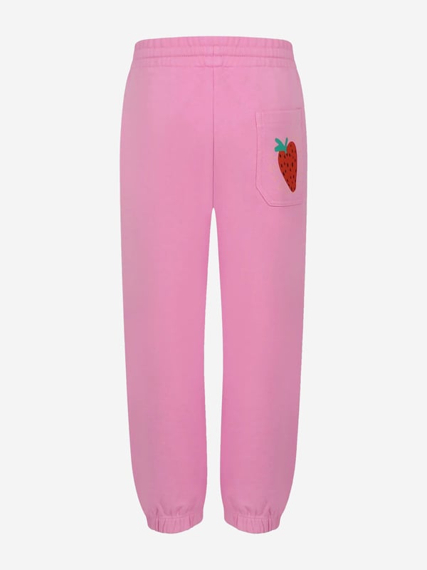 Introducing the sublime Stella McCartney Girls Logo Joggers in Pink an essential enhancement for your girl's wardrobe this SS2025. Meticulously tailored, each feature ensures a harmonious blend of elegance and comfort Chic Pink Shade Exude sophistication with the iconic pink hue, complementing any look with effortless charm. Signature Logo Detail Stella's revered branding accentuates these joggers, adding a distinctive touch of luxury. Premium Fabric Crafted from superior materials, ensuring both sustainability and softness for delicate skin.Revitalise her ensemble with this pink perfection. Purchase todaywhere style meets comfort.