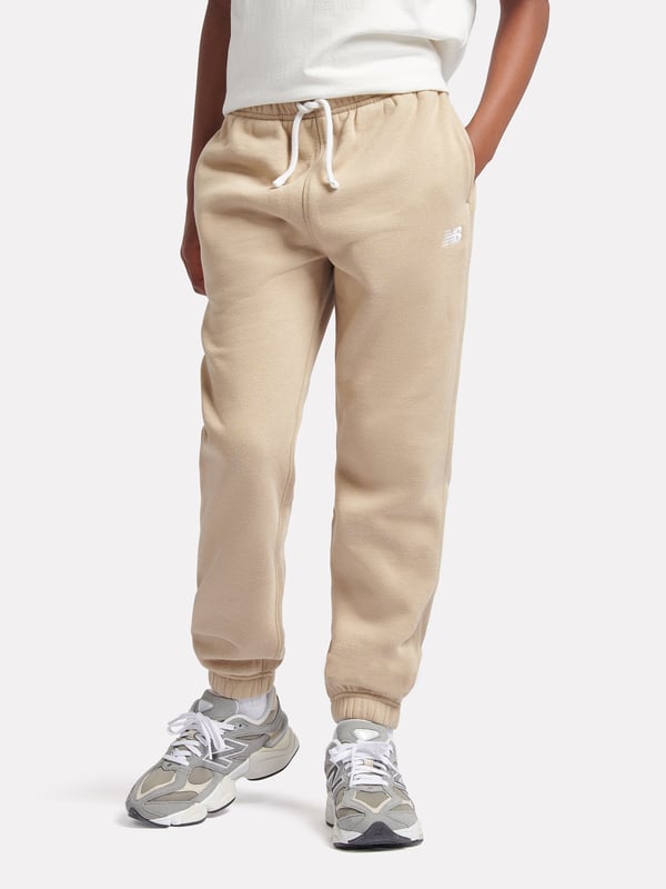 New Balance Boys Brush Back Small Logo Joggers in Beige Introducing the Boys Brush Back Small Logo Joggers in Beige by New Balance, an essential addition to your little one's wardrobe for AW2024. Elegantly designed to blend high-end style with practical comfort, here's what makes these joggers a must-have Subtle Elegance Classic beige with a discreet New Balance logo, perfect for versatile styling. Premium Comfort Crafted from soft, superior fabric ensuring all-day ease and durability. Tailored Fit Snug yet flexible fit suited for playful days and quiet evenings alike. Enhance your boys wardrobe with a touch of class comfort. Order now!