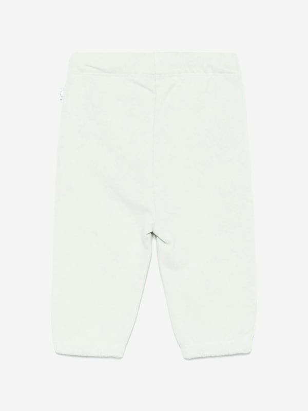 Baby Boys Ice Cream Joggers in Green Introducing the exquisite Baby Boys Ice Cream Joggers in Green by Stella McCartney, a quintessential addition for SS2025! Crafted for the fashion-forward youngster, these joggers blend quintessential charm with playful elegance. Key highlights include Enchanting Ice Cream Motif Designed with a whimsical ice cream print, these joggers ensure your little one is always in vogue. Luxurious Comfort Tailored from premium fabrics, they promise both style and unparalleled comfort. Vibrant Green Hue The lively green shade enhances any outfit, making it perfect for stylish escapades.Revitalise your young one's wardrobe with these stellar joggers from Stella McCartney. Perfect for every little trendsetter!