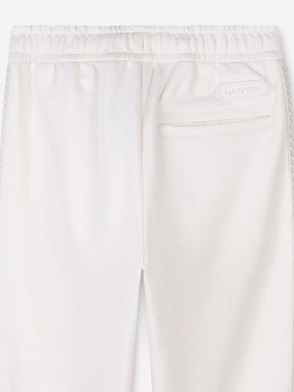 Lanvin project classic beauty and refined innovation into their meticulously crafted designs. Engineered in organic cotton French terry. They feature curb braids on the leg sides, an elasticated waist with lace, and tone on tone Lanvin logo embroidery at the front. Complete with a Lanvin Logo rubber label at the back above a piped pocket. Straight Hem 100 Cotton