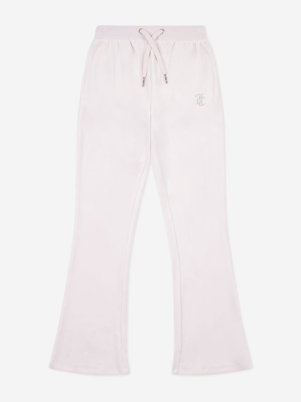 Juicy Couture is an American brand infused with an irreverent attitude and casual glamour synonymous with the velour tracksuit. These girls pink joggers are a captivating construction. Envisioned in velour with pockets and an elasticated drawstring showcasing diamante brand detail. The piece is signified by the sparkly 'JC' motif on the front pocket. 95 Polyester, 5 Elastane