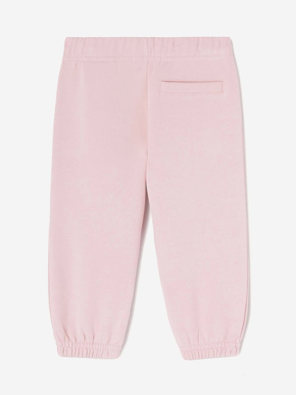 Introducing the Baby Girls The Palm Logo Joggers in Pink by Palm Angels, an essential addition to your little one's wardrobe for SS2025. Crafted for comfort and style, these joggers promise to keep your baby cosy while looking charmingly stylish. Key features include Iconic Palm Design Embellished with the signature Palm Angels logo for a distinguished touch. Luxurious Comfort Soft, high-quality fabric ensures comfort for all-day wear. Perfect Pink A vibrant pink shade that complements any outfit effortlessly.Elevate her style with timeless elegance order today!