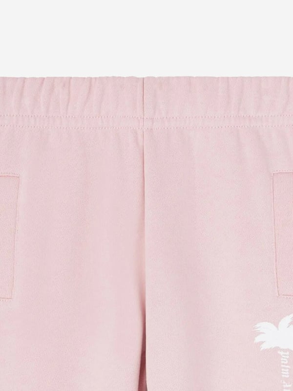 Introducing the Baby Girls The Palm Logo Joggers in Pink by Palm Angels, an essential addition to your little one's wardrobe for SS2025. Crafted for comfort and style, these joggers promise to keep your baby cosy while looking charmingly stylish. Key features include Iconic Palm Design Embellished with the signature Palm Angels logo for a distinguished touch. Luxurious Comfort Soft, high-quality fabric ensures comfort for all-day wear. Perfect Pink A vibrant pink shade that complements any outfit effortlessly.Elevate her style with timeless elegance order today!