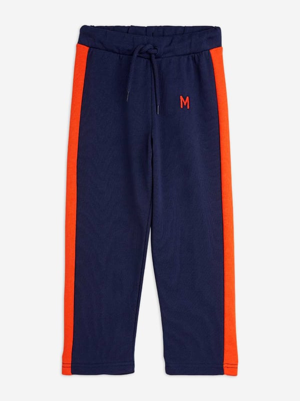 Introducing the Boys Panel Embroidered Joggers in Navy by mini rodini, a quintessential addition for your boy's wardrobe for SS2025. Merging sophistication with playfulness, these joggers epitomize high-end comfort with a dash of flair. Key features include Exquisite Embroidery Elegant detailing that elevates the everyday. Premium Fabric Crafted in luxurious, breathable materials. Versatile Navy Hue Perfect for mixing and matching. Refresh your child's attire with a touch of designer charm shop these joggers today!