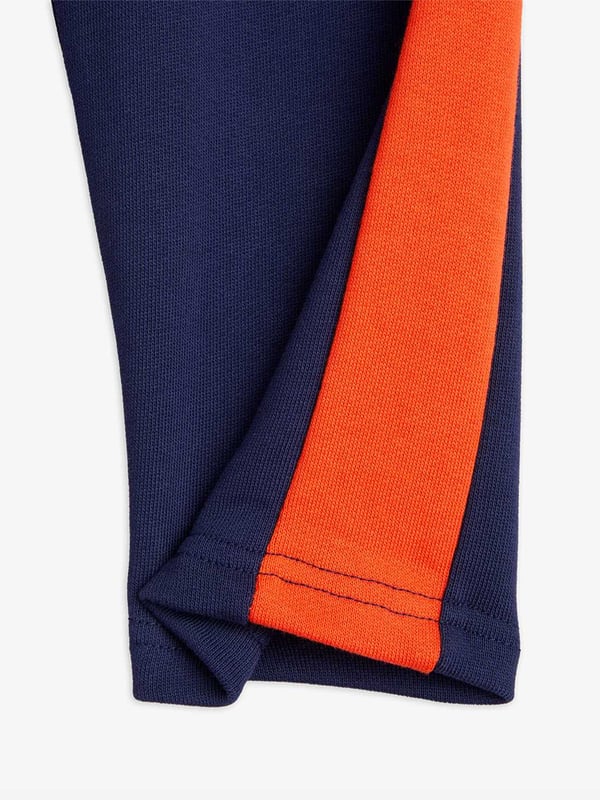 Introducing the Boys Panel Embroidered Joggers in Navy by mini rodini, a quintessential addition for your boy's wardrobe for SS2025. Merging sophistication with playfulness, these joggers epitomize high-end comfort with a dash of flair. Key features include Exquisite Embroidery Elegant detailing that elevates the everyday. Premium Fabric Crafted in luxurious, breathable materials. Versatile Navy Hue Perfect for mixing and matching. Refresh your child's attire with a touch of designer charm shop these joggers today!
