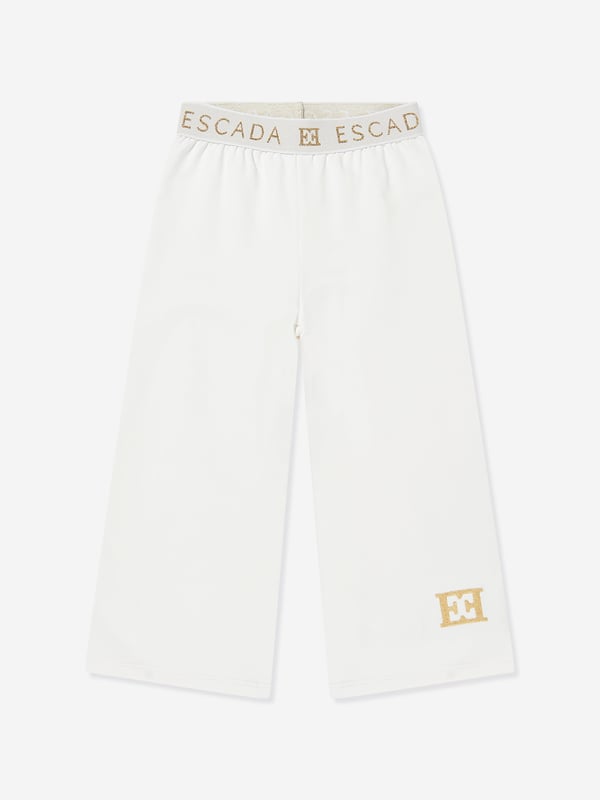 Escada incorporate high standards of elegance and unbeatable glamour into their aesthetics. These girls snow white joggers are woven in beautiful high quality with a tape elasticated waistband and Escada golden print. Straight Hem 95 Cotton, 5 Elastane