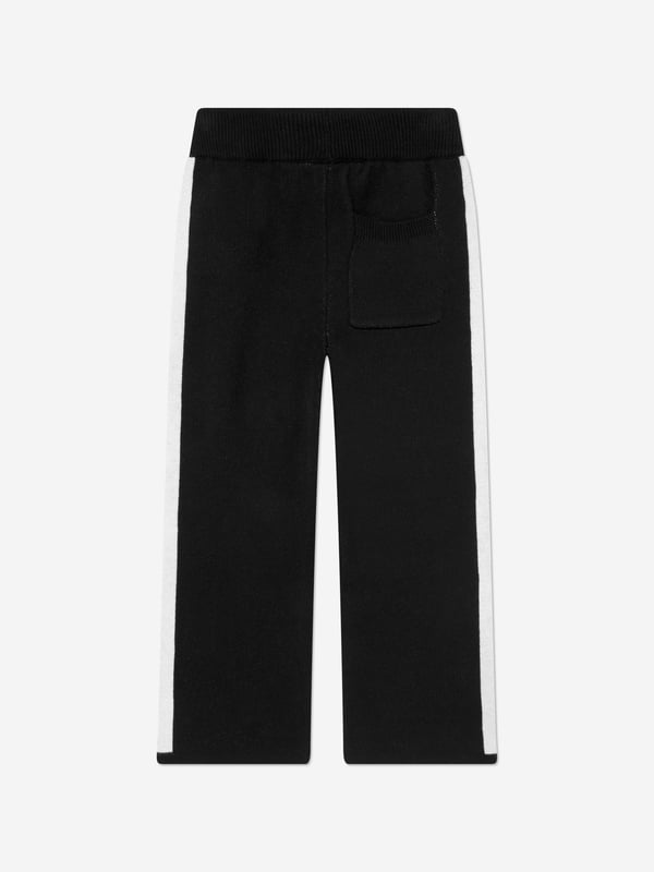 The Couture Club embody innovation and sophistication in their streetwear portraits. These kids side stripe knitted joggers in black are made from beautiful high quality. Functional Welt Pocket to Back Straight Leg Knitted Joggers Wide Contrast Panelling Ribbed Waistband With Drawcords Embroidered Contrast Logo to Front Left Leg Ribbed Welt Side Pockets 100 Cotton