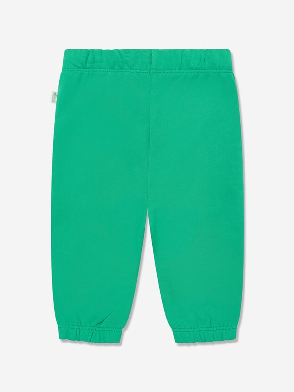 Stella McCartney portray a vibrant aesthetic via their cool and beautifully crafted designs. These baby unisex green joggers are woven from beautiful organic cotton. They showcase an elasticated waist with side pockets and ribbed ankles. Embellished with frog prints on the legs. 100 Organic Cotton