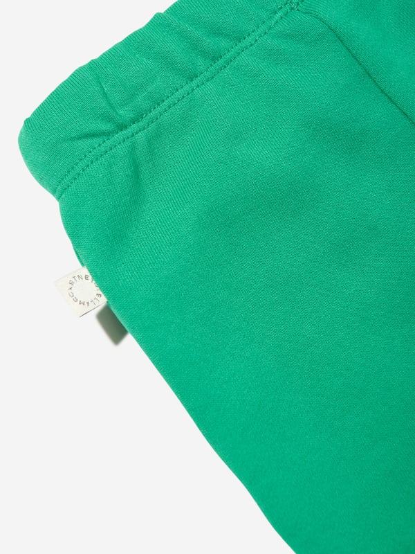 Stella McCartney portray a vibrant aesthetic via their cool and beautifully crafted designs. These baby unisex green joggers are woven from beautiful organic cotton. They showcase an elasticated waist with side pockets and ribbed ankles. Embellished with frog prints on the legs. 100 Organic Cotton